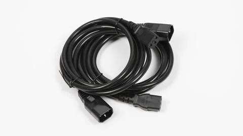 Two black power cord C13-C14 connector, on white. Side view. Stock Footage 168532471