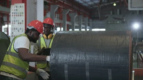 Two black workers engineer factory textile inspection and checking inventory Stock Footage 186351177