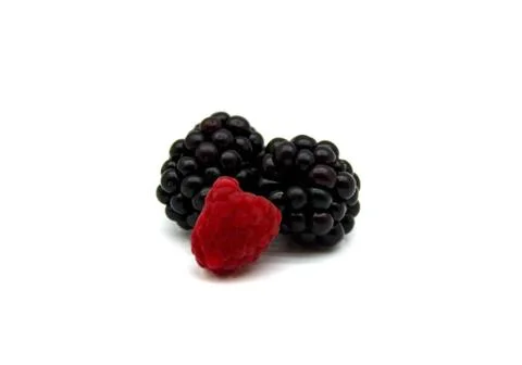 Two blackberries and one raspberry Foto stock