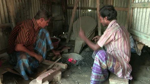Two Blacksmiths are making iron products Stock Footage 76733416