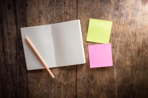 Two blank colorful sticky notes and notebook and pencil Stock Photos