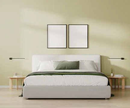 Two blank frames mock up above bed in bedroom interior in light green tone, 3 Illustrazione stock
