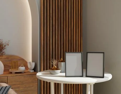 Two blank frames on a white table in a modern, warm room with wooden accents Иллюстрация