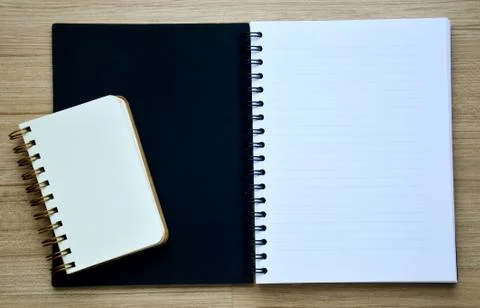 Two blank notebook on the wood table - top view Stock Photos