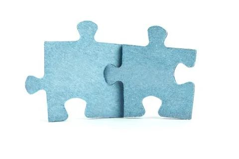 Two blank puzzles on white isolated background. Concept. Stock Photos