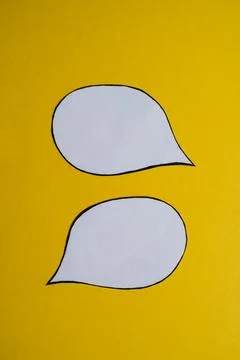 Two Blank Speech Bubbles on Yellow Background Stock Photos