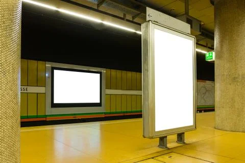 Two Blank Subway Advertisements in Brightly Colored Space Urban Environment Stock Photos