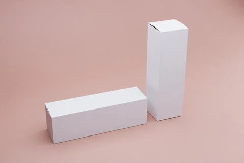 Two blank white boxes on pink background, packaging mockup Stock Illustration
