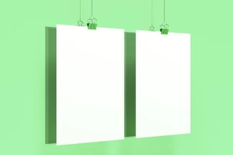 Two blank white posters with binder clip mockup on green background Stock Illustration