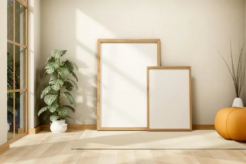 Two blank white wooden frames aside pumpkin stool chair and houseplant pot .. イラスト素材
