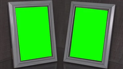 Two blank wooden photo frames stands on glass shelf at home Stock Footage 171066153
