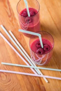 Two blended thick smoothie from raspberry with tubule Stock Photos