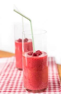Two blended thick smoothie from raspberry with tubule Stock Photos