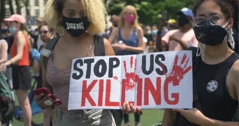Two BLM Protesters Hold Sign - Stop Killing Us with Hands Up Stock Footage 248851154
