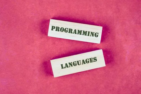 Two blocks display the words Programming and Languages against a vibrant pink Stock Photos