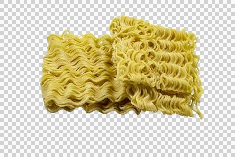 Two blocks of dry, wavy, yellow instant ramen noodles stacked on a plain. Stock Photos