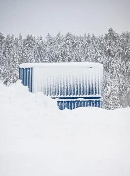 Two blue containers in deep snow Stock Photos