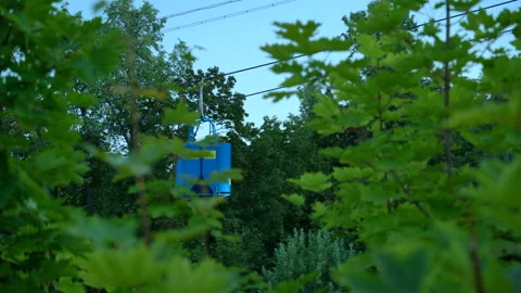 Two blue funiculars meet during the descent and ascent of the mountain Stock Footage 158446831