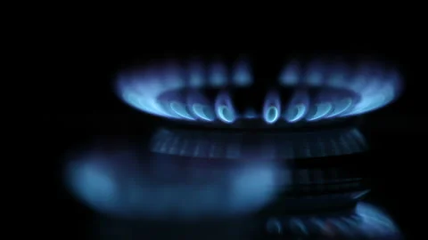 Two Blue Gas Flames Igniting on Kitchen Stove Stock Footage 220641683