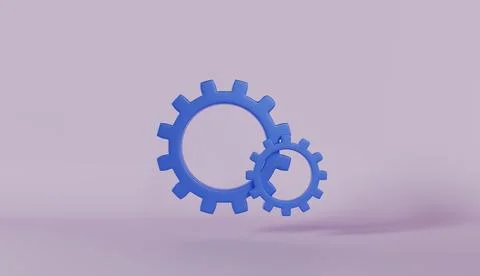 Two blue gears interlock together representing mechanical teamwork Stock Photos
