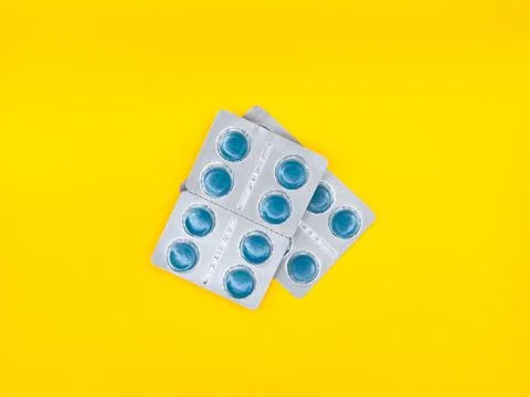 A two blue pill pack a white background. copy space, flay lay, top view Stock Photos