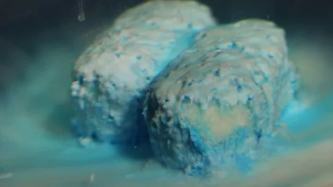 Two Blue Pills Dissolve Abstract Macro Stock Footage 74728543