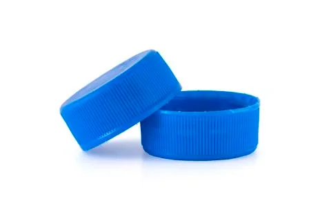 Two blue plastic bottle caps Stock Photos