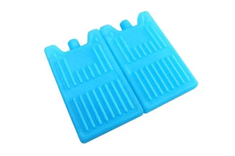 Two blue plastic ice pack coolers with striped texture isolated on a white .. Stock-Fotos