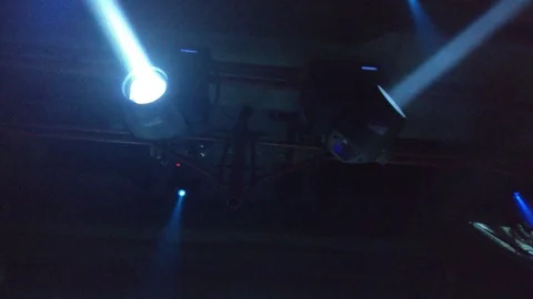 Two blue projectors on the ceiling of the techno club rotate Video stock 88208161