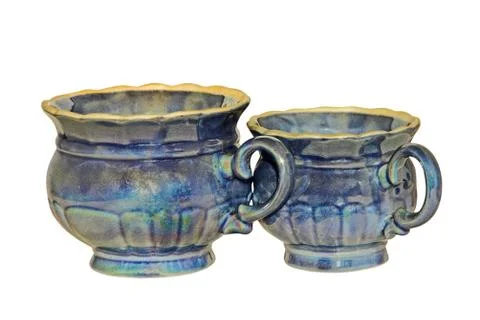 Two blue retro style ceramic tea cups isolated on white. Stock Photos