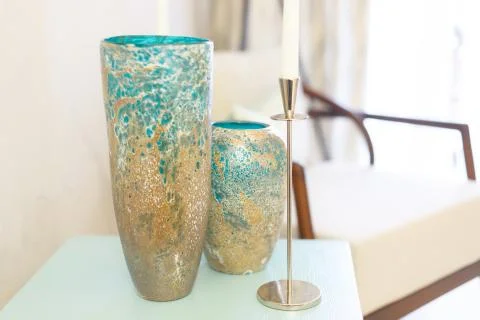 Two blue textured vases in the interior. They stand on a shelf in the living  Stock Photos