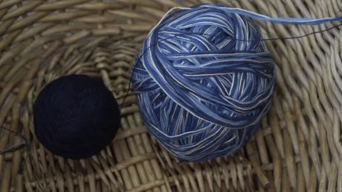 Two blue threads being untanggled Stock Footage 144637767