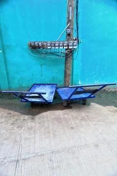Two blue-three wheeled pushcarts  and electricity meters. Puerto Princesa-PH Stock Photos