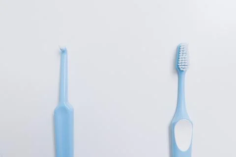 Two blue toothbrushes at different distances on a white background Stock Photos