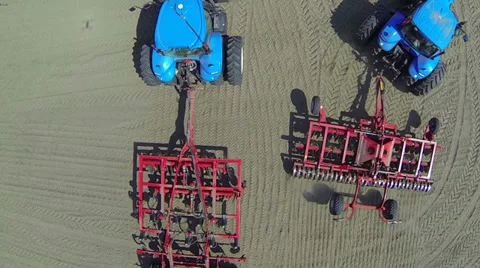 Two blue tractor in the field with trailers. Aerial view. Stock-Footage 37669660