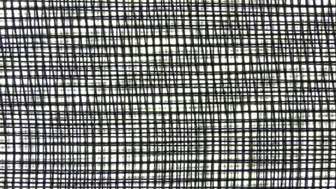 Two blurred repeating metal meshes. Stock Footage 150486038