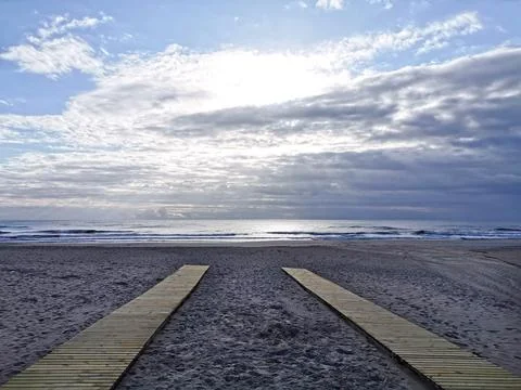 Two boardwalk on beach, question for decide Stock Photos