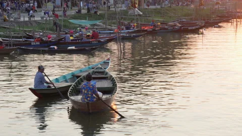 Two boatmen rowing and talking to each other in evening Stock Footage 88724365