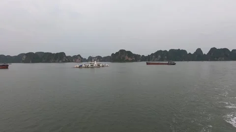 Two boats almost crashed in the sea in Halong bay, cloudy weather Stock Footage 212671283