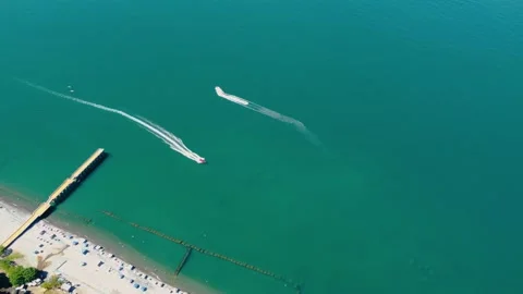 Two boats float on the black sea turquoise water in Georgia, Batumi. Video stock 229781765