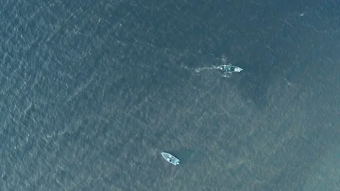 Two boats float in different directions in the sea on the waves. Stock Footage 165405360