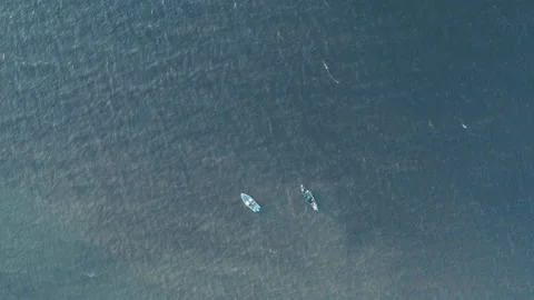 Two boats float in different directions in the sea on the waves. Stock Footage 165405424