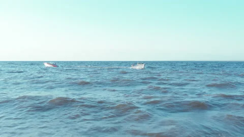 Two boats float in different directions in the sea on the waves. Stock Footage 165405551