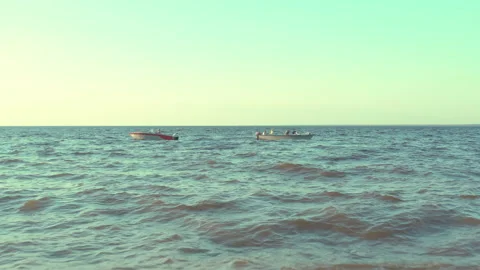 Two boats float in different directions in the sea on the waves. Stock Footage 165405626