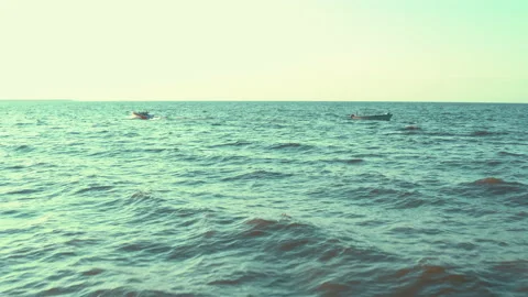 Two boats float in different directions in the sea on the waves. Stock Footage 165406086