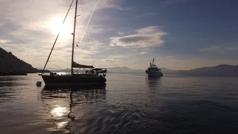 Two boats on the Mediterranean Sea during the sunset, Marseille, France Stock Footage 103317841