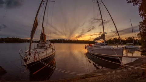 Two boats moored to the rocks Stock Footage 87820857