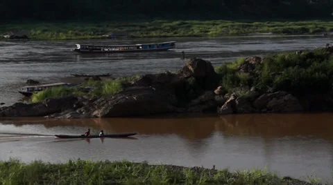 Two Boats pass at a Mekong river junction Laos Stock Footage 34181330