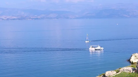 Two boats sail to meet each other. View of the bay, the blue expanse of water Stock Footage 121802172