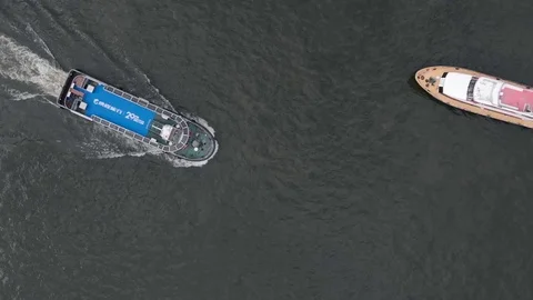 Two boats sail on the river from different sides and diverge from each other. Stock Footage 118114259